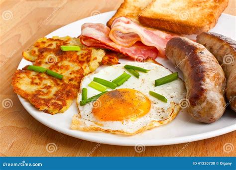 Fried Egg Hash Browns And Bacon Breakfast Stock Photo Image Of Fried