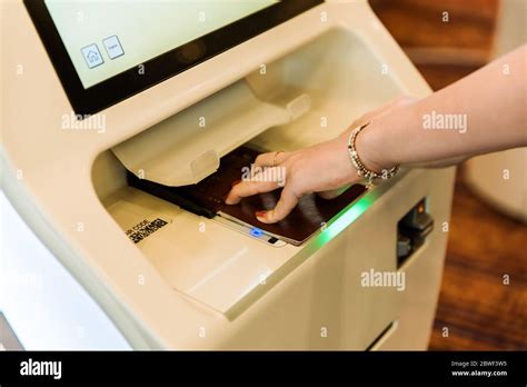 Self Service Electronic Boarding System And Passport Reader At The Airport Self Check In