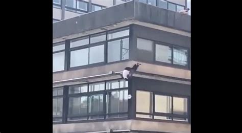 Man jumps down several stories of building like he's Spiderman