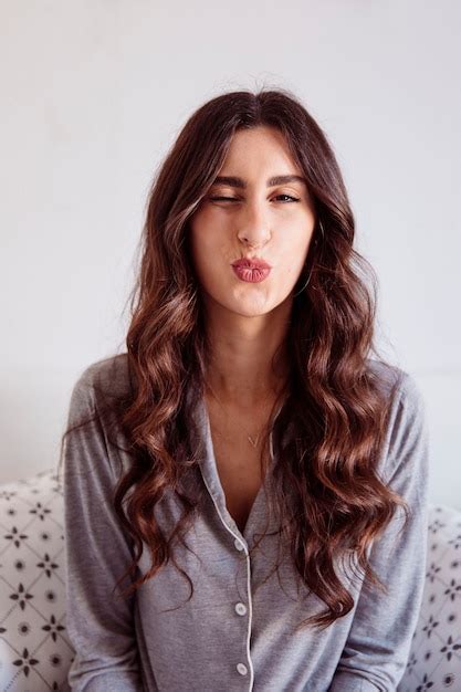 Free Photo Winking Brunette Kissing Air