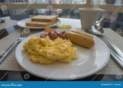 Breakfast With Scrambled Eggs Sausage And Bacon Stock Image Image Of