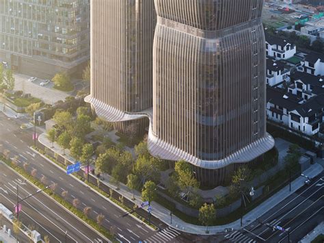 Lotus-Inspired Skyscrapers with Aluminum and Glass Facades in China | Aedas