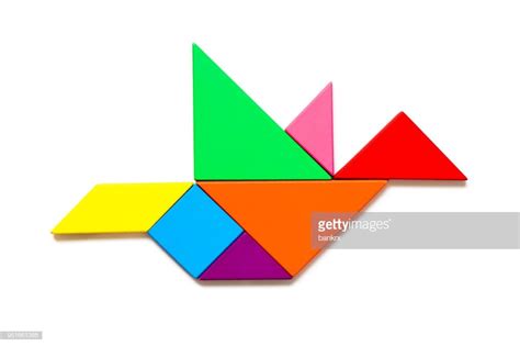 Color Wood Tangram Puzzle In Flying Bird Shape On White Background