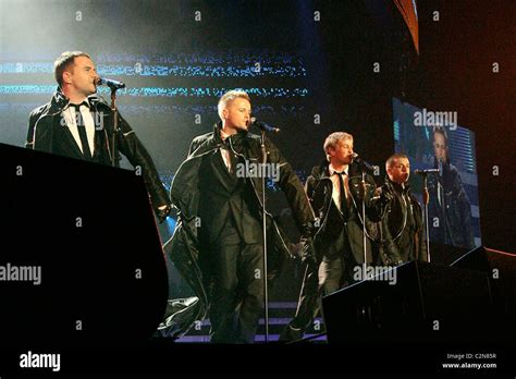 Westlife performing live in concert at Wembley Arena London, England ...