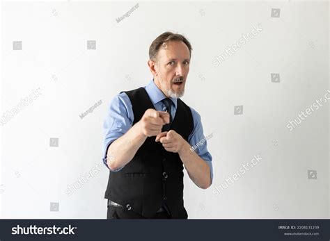 Portrait Excited Mature Businessman Pointing Camera Stock Photo