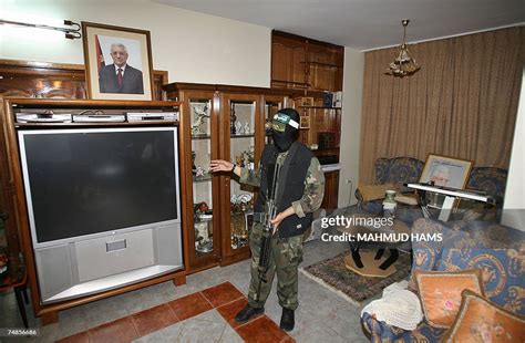 Abu Obeida, a spokesman for Hamas's armed wing, stands inside... News Photo - Getty Images