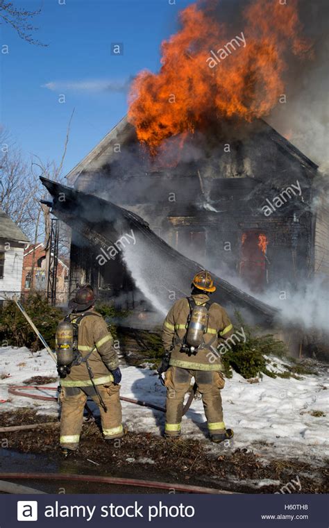 Firefighters Extinguishing House Fire Detroit Michigan Usa Stock