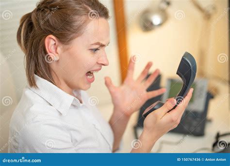 Girl Dispatcher Shouts Working With The Phone In The Call Center