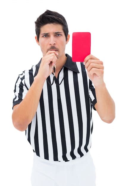 Premium Photo Serious Referee Showing Red Card