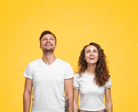 Premium Photo Excited Couple Looking Up