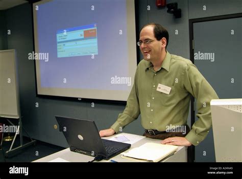 Adult Computer Class Training Is Conducted During A Business Meeting