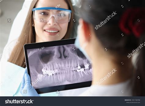 1 Dentist Doctor Examines Ray Picture Tablet Screen Chair Woman Patient