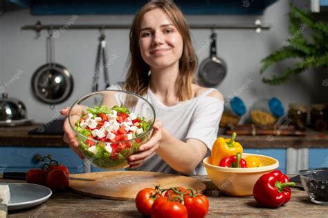 Premium Photo Young Girl Prepares A Vegetarian Salad In The Kitchen