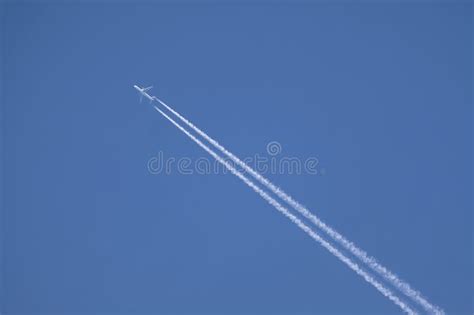 Passenger Aircraft Flying High In Blue Sky Stock Image Image Of