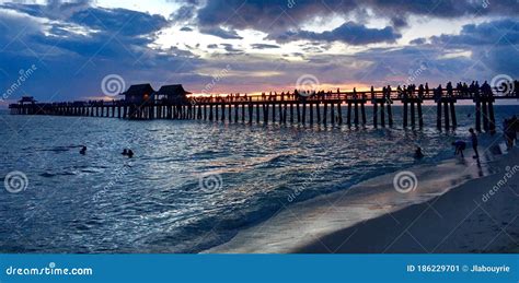 Naples Pier and Beach in Florida at Sunset Editorial Photo - Image of ...