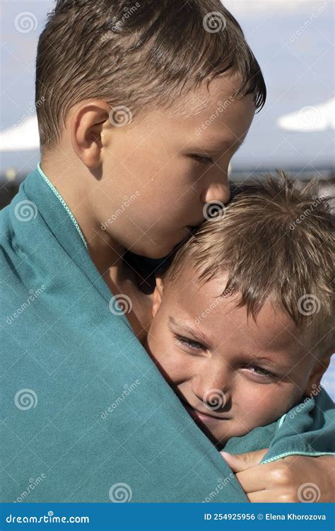 Emotional Brother Hugging Sister In The Park Outdoors Stock Photography