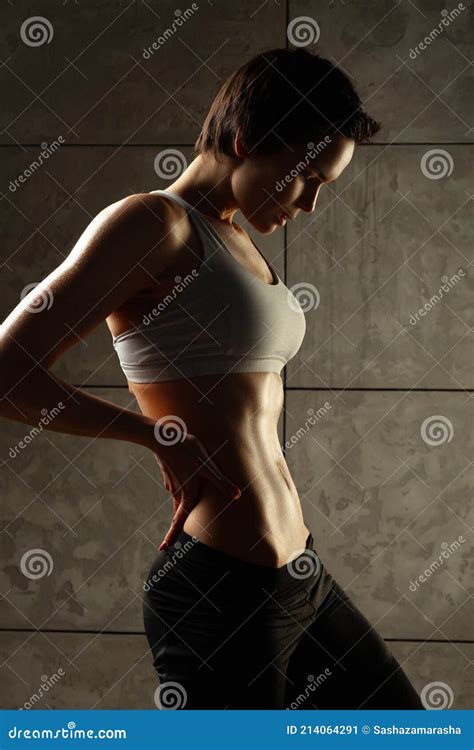 Fitness Woman Showing Abs And Flat Belly Perfect Abdomen Muscles Stock