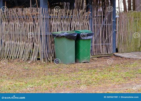 Two Green Trash Bin For Disposing Of Organic And Inorganic Waste Stock