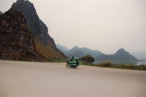 Premium Photo Motorbike Driver On The Road To Tam Coc Ninh Binh Vietnam