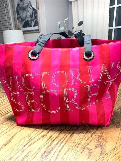 Victorias Secret Tote Pink Striped With A Black Handles Small Rip On Top And Small Rip On