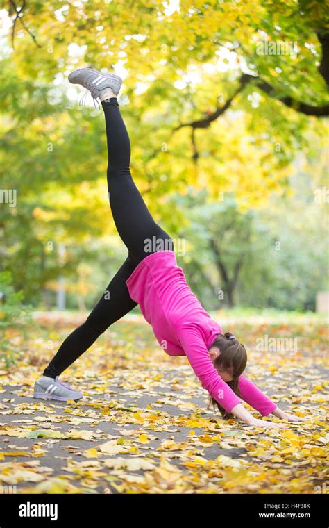 Yoga Outdoors One Legged Downward Facing Dog Pose Stock Photo Alamy