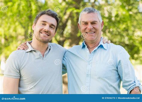 Smiling Father With Adult Son At Park Stock Image Image Of Casual