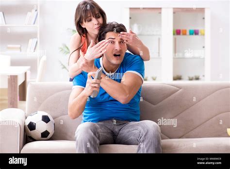 Wife Unhappy That Husband Is Watching Football Stock Photo Alamy