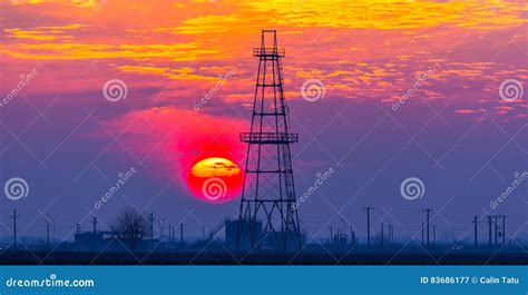 Abandoned Oil and Gas Rig Profiled on Dramatic Evening Sky Stock Image ...