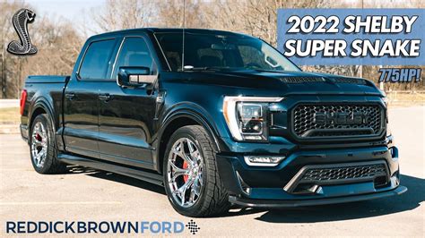 A Black Truck Parked In A Parking Lot With The Words 2021 Shelby Super