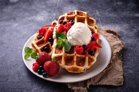 Premium Photo Belgium Waffles With Berries And Ice Cream