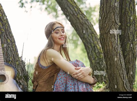 Beautiful Hippie Girl Sitting Near Trees In Forest Stock Photo Alamy