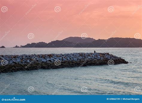 Silhouette Watching Sunset On Langkawi Island In Malaysia Stock Image