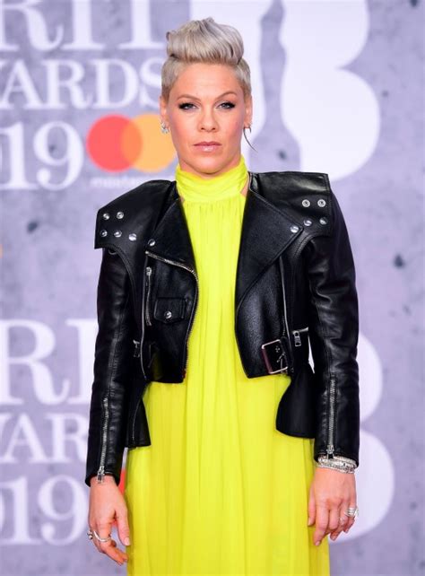 Pink is our hero as she sips wine on floor after being locked out ...
