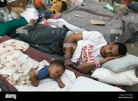 Hurricane Katrina survivors from New Orleans rest after being evacuated ...