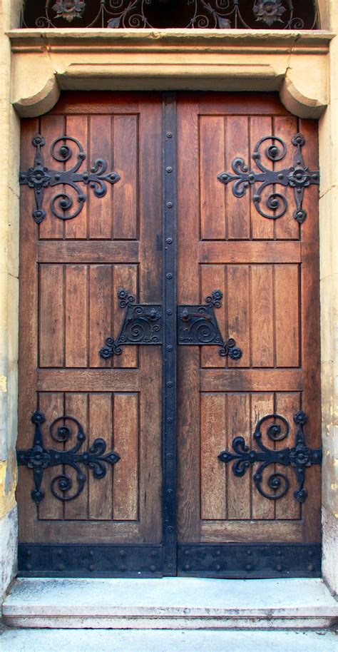 Rustic Wooden Doors With Wrought Iron Designs