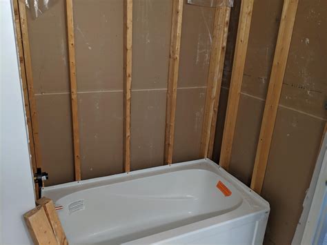 Does Green Drywall Go Behind The Lip Of The Tub Or Does It Overhang