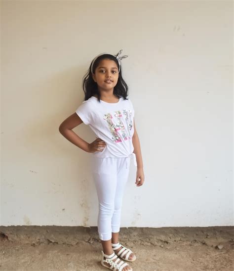 Premium Photo Portrait Of Girl Standing Against White Wall