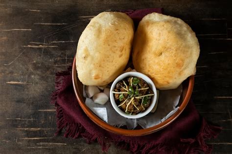 Premium Photo Chole Bhature Or Channay Pathuray And Puri Served In