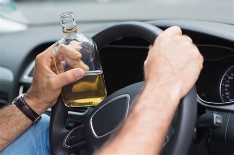 Premium Photo Man Drinking Alcohol While Driving