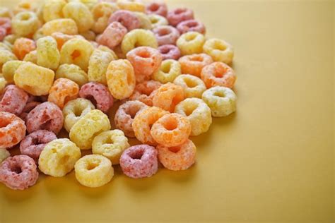 Premium Photo Fruit Cornflakes On A Yellow Background