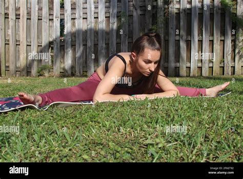 Young Woman Doing Yoga Outside Stock Photo Alamy