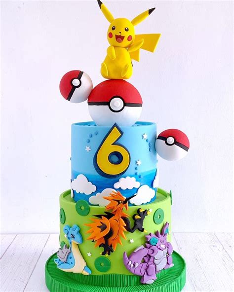 A Pokemon Birthday Cake With The Number Six On Top