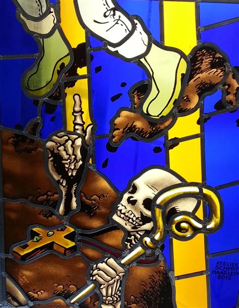 A Stained Glass Window With A Skeleton Holding A Cross