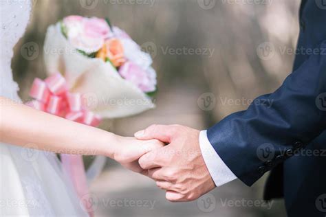 Loving Young Love Married Couple Holding Hands And Stand Together In