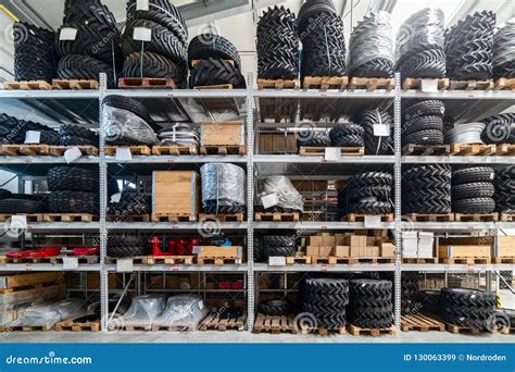 Industrial Warehouse Of Spare Parts On The Shelves Are Many Tires