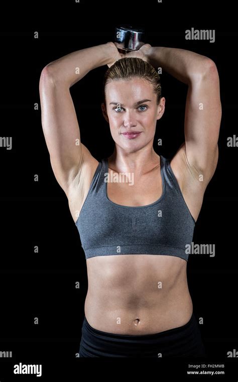 Muscular Woman Lifting Heavy Dumbbells Stock Photo Alamy