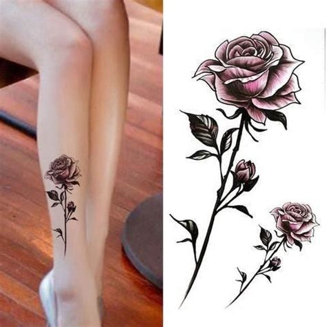 A Woman S Legs With Tattoos On Them And One Has A Rose Tattooed On It