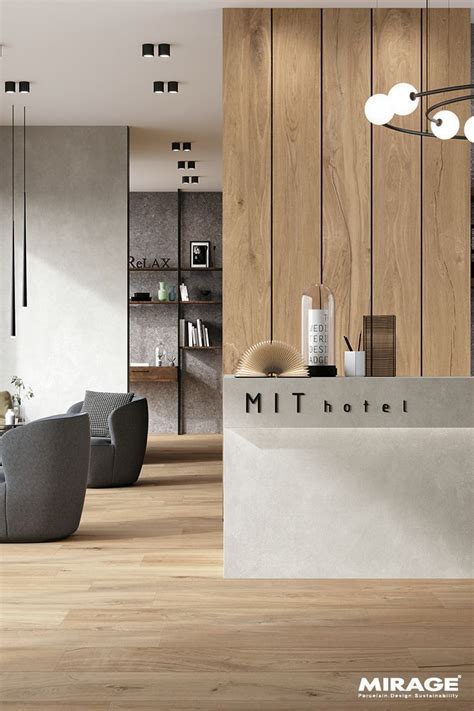 A Modern Hotel Reception Area With Wood Paneling And White Walls Along