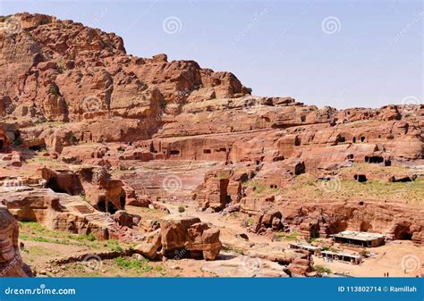 Ancient Roman Amphitheatre And Building Structures On Rocky Mountains