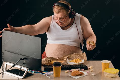 Obese Man Talking With A Computer Close Up Portrait Isolated Black